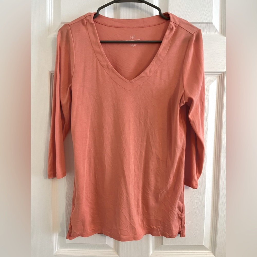 Light slightly grayish orange pinkish color V-neck